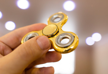 The golden spinner is spinning in his hand