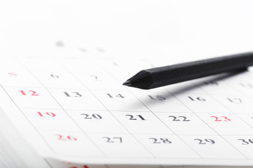 Check out the dates in a business calendar concept