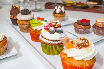 Tasty and creative cupcakes isolated with a white background