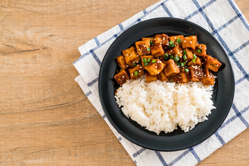 stir fried tofu with spicy sauce on rice