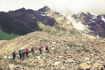 Hiking in beautiful mountains. Group of hikers enjoy the weather