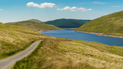 Obraz premium Welsh landscape and a country road at the Nant-y-Moch Reservoir, Ceredigion, Dyfed, Wales, UK