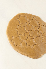 Gingerbread Cookie. Ready dough. Shape star. White background.