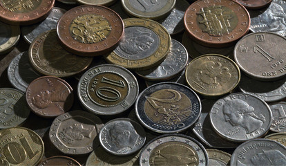 A pile of coins from different countries