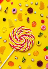 colorful candy on the yellow background