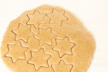 Raw dough. Pattern ginger biscuits. Star shape