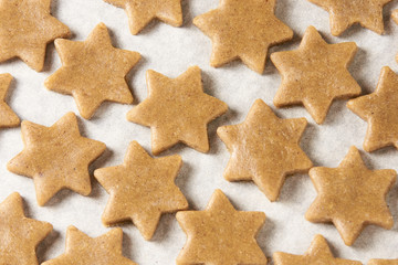 Raw dough. Cooking. Ginger biscuit star