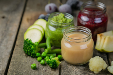 Colorful baby food purees in glass jars