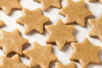 Raw dough. Ginger biscuit star. Cooking