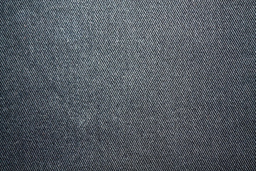 Fototapeta na wymiar Detailed closeup of blank grungy denim. Vintage dark gray jeans, good for background