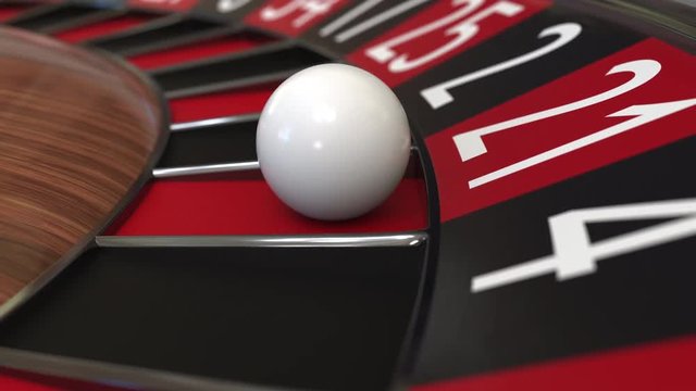 Casino roulette wheel ball hits 21 twenty-one red