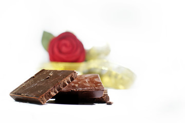 Chocolate bar. Dark chocolate. Chocolate decorated with red roses. and ribbon.