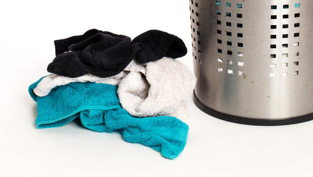 Dirty laundry in a metal basket