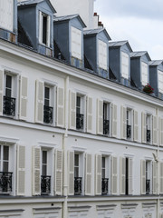 Fototapeta premium Paris, France. Typical Houses in Paris with special attention to their roofs and windows