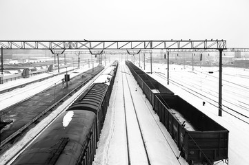 Top view of freight train with carriages on railways at winter. Selectuve focus