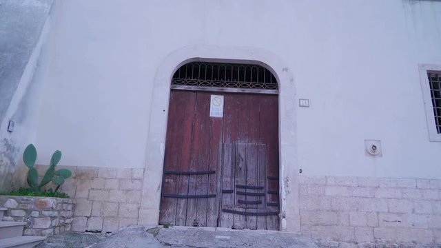 15920_A_big_brown_door_and_a_small_green_window.mov