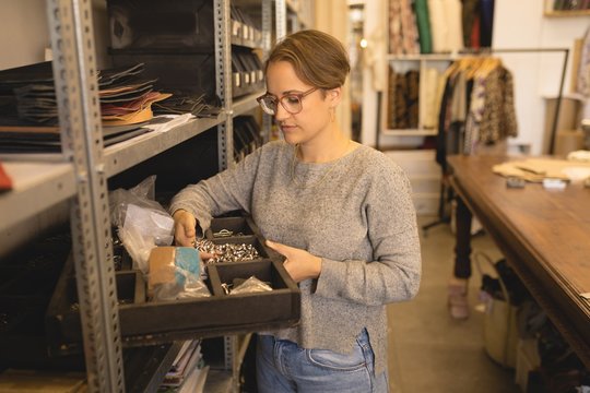 Female worker looking at tools