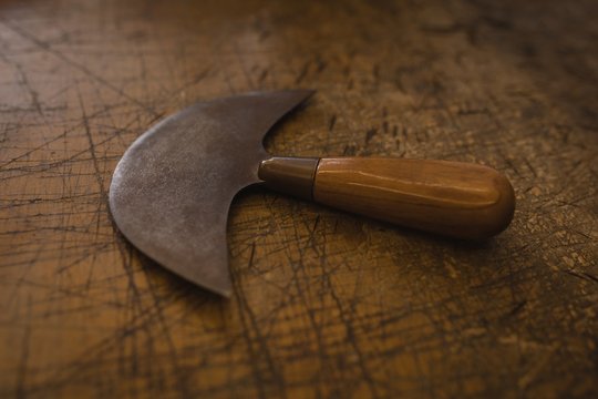 Half moon foot knife on table