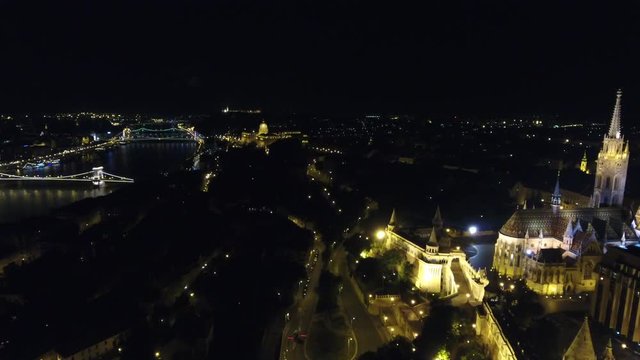 Matthias church, Chain bridge and Buda Castle aerial view at night, Budapest, Hungary