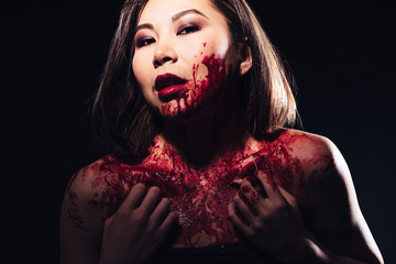 girl in blood makeup on sark background