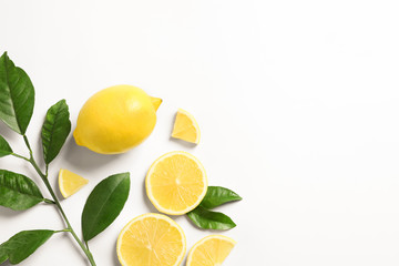 Composition with ripe lemons on white background