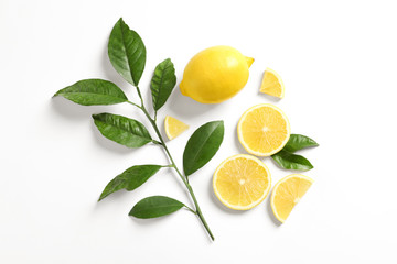Composition with ripe lemons on white background