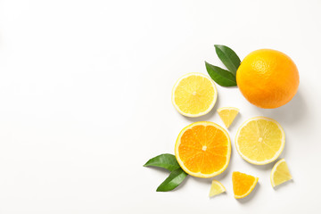 Composition with ripe lemons and oranges on white background - Powered by Adobe