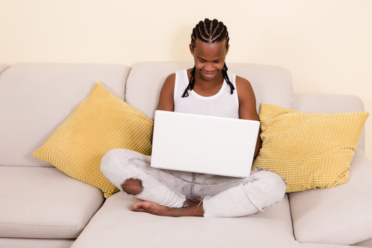 Cheerful black man with laptop