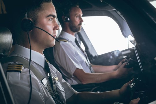Pilot and copilot flying an airplane