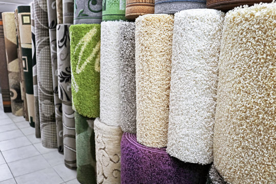 Assortment of different carpets in store