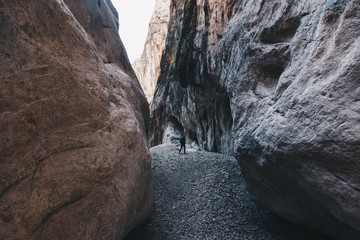 Man hiking insdide the deepest canyon  in Europe - Activity and Health concept.
