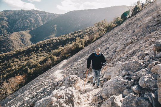 Old man hiking - activity and health concept