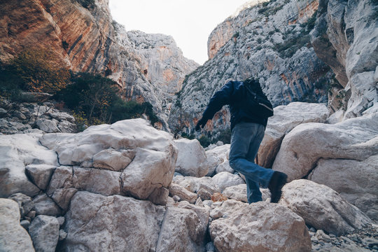 Old man hiking insdide the deepest canyon  in Europe - Activity and Health concept