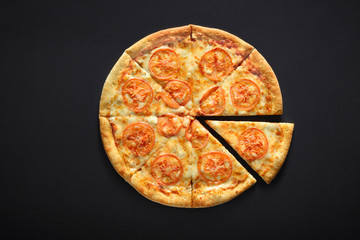 pizza margarita on black stone background with Tomatoes, Cheese Mozzarella