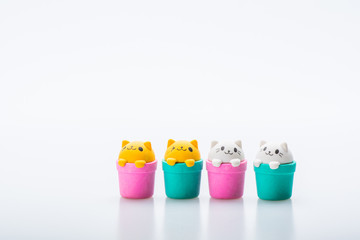 Colorful rubber cat icon isolated on white background. Concept of cuteness and element of surprise . Isolated on white background. Slightly de-focused and close-up shot. Copy space.