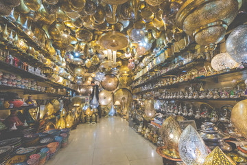 Selection of traditional lamps on sale at a market stall in souks of Marrakech, Morocco.