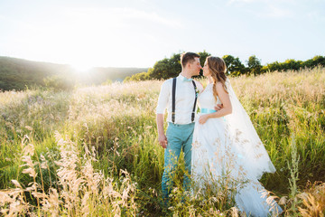the bride and groom are photographed on the nature