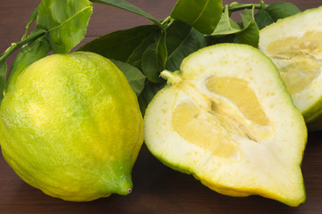 Citron in wood background with one open