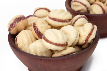 Traditional Brazilian guava paste cookies called goiabinha in a wood bowl 