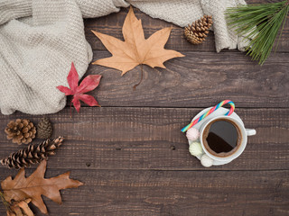 Hot coffee, bise and colorful candy on a wooden table