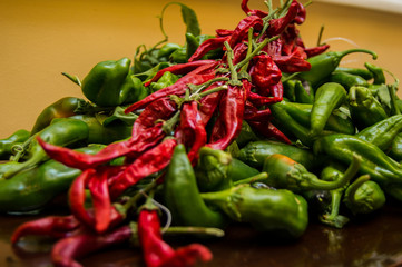Mountain of organic green and red (chilli) peppers. Fresh and raw vegetables harvest.