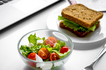 concept of lunch in office at work desktop