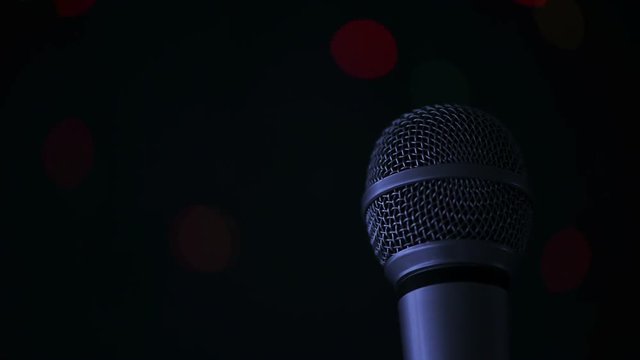 Karaoke night, microphone with bokeh light in background