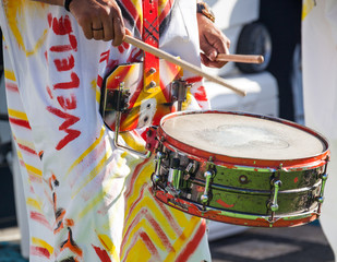 Drummer plays snare drum on caribbean island