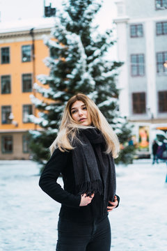 Pretty stylish woman on winter street