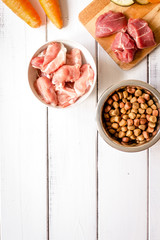ingredients for pet food holistic top view on wooden background