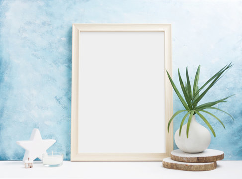 Vertical wooden Photo frame mock up with plants in vase, ceramic decor on shelf. Scandinavian style. Text space