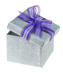 Beautiful shining silver gift box with purple ribbon tied in a bow isolarted on white background