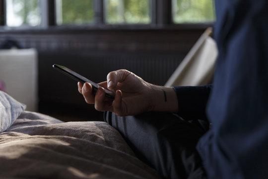 A man operating a smart phone.