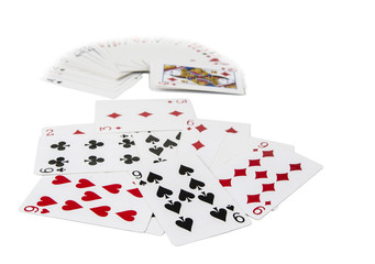 Playing cards spreaded on the white background